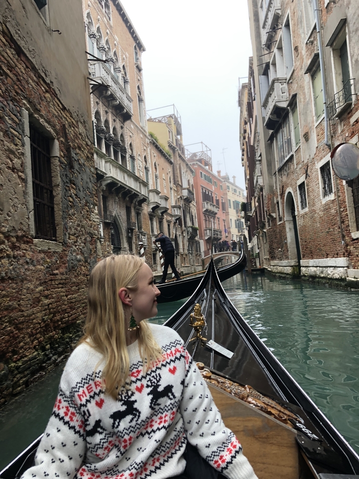 Gondola ride through a Venetian canal.