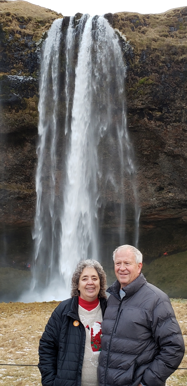 Water cascading down in a waterfall scene.