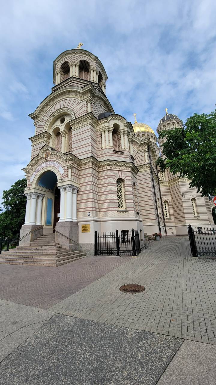Ornate cathedral with golden dome and decorative architecture.