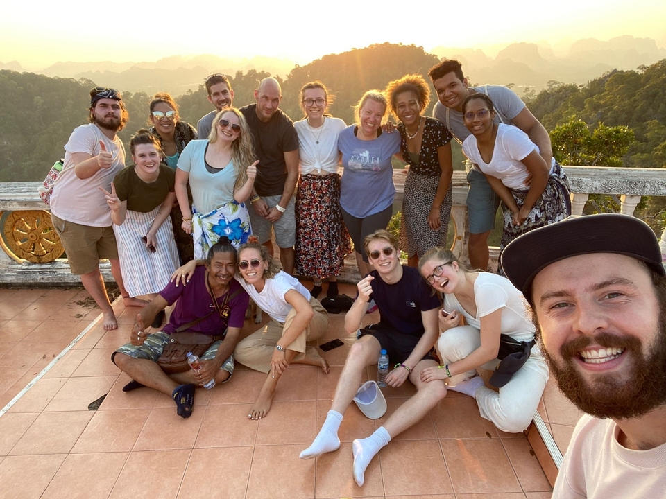 Group of friends posing at a scenic overlook.
