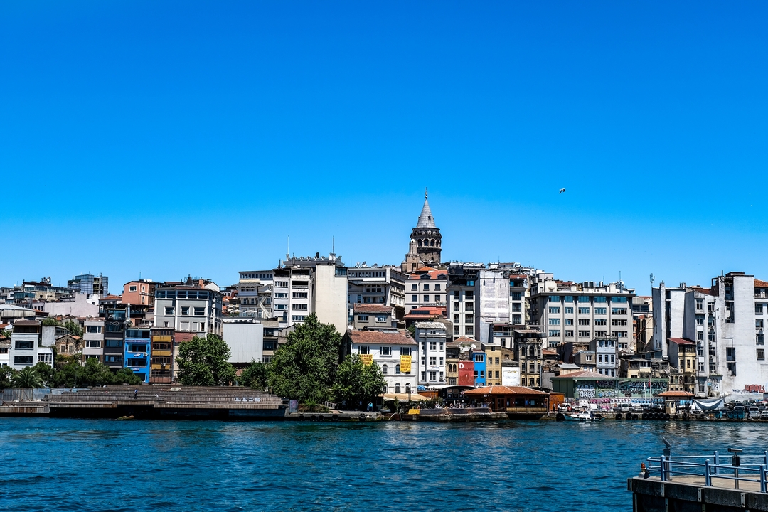 A cityscape view of Istanbul with buildings by the water.