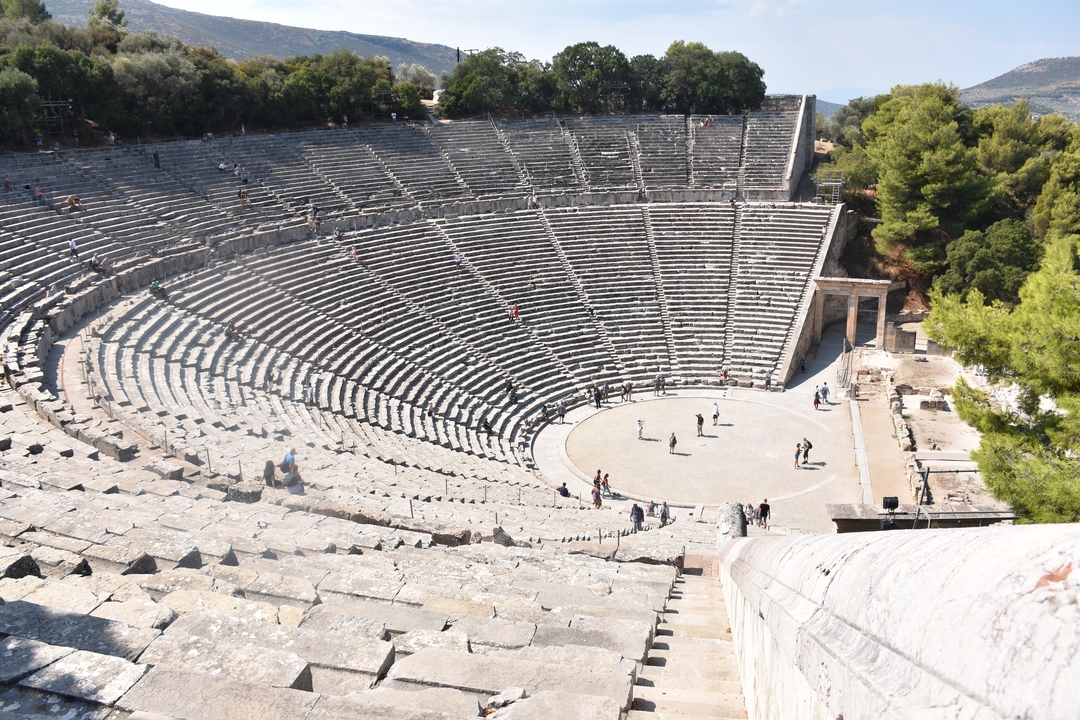 Sweeping view of the semicircular stone seating of the ancient theatre of Epidaurus