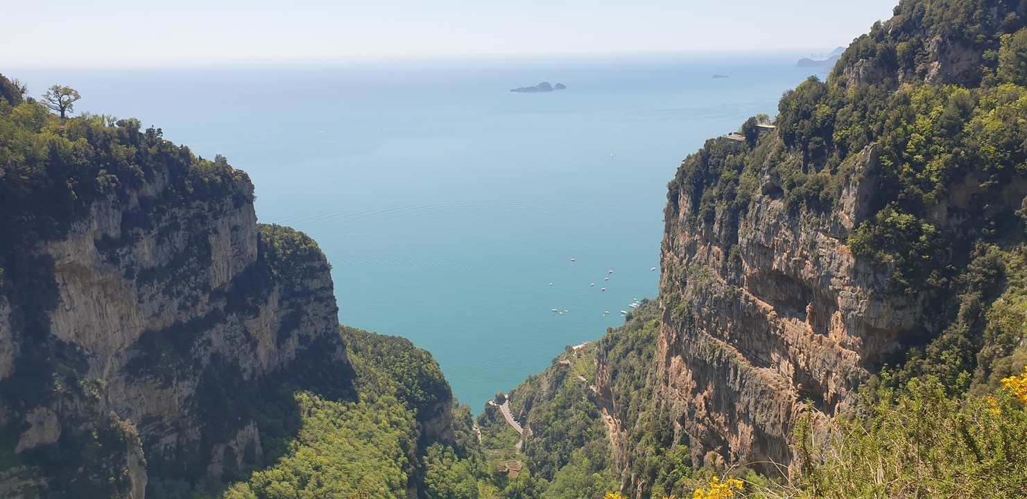 A stunning coastal view with cliffs and clear blue sea.