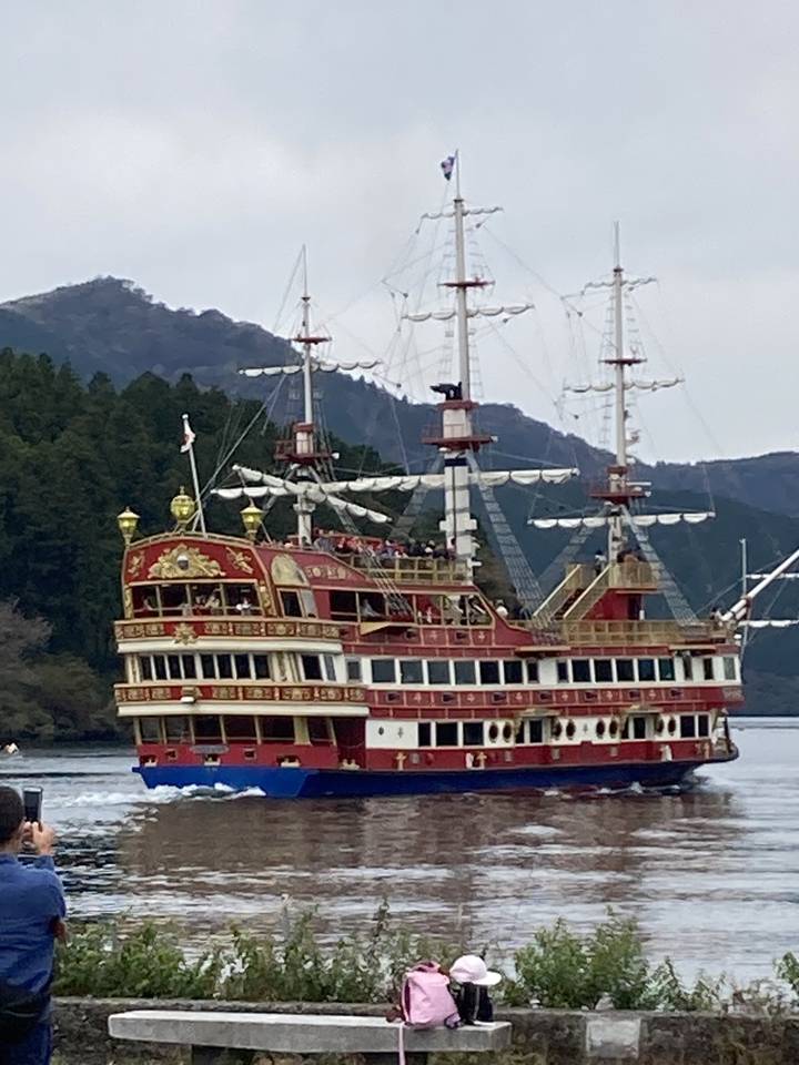 Pirate ship on Lake Ashi with misty hills in the background.