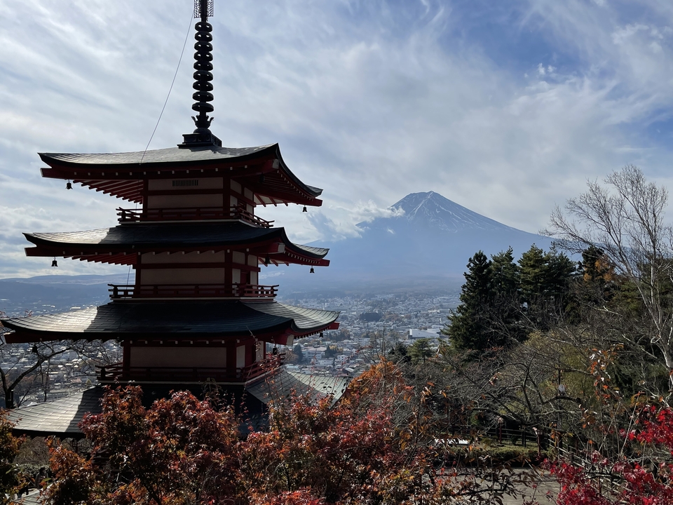 A pagoda with Mount Fuji in the background.