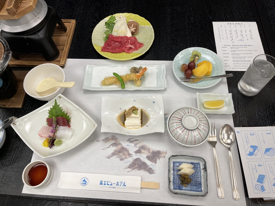 An assortment of Japanese dishes arranged neatly on a table.