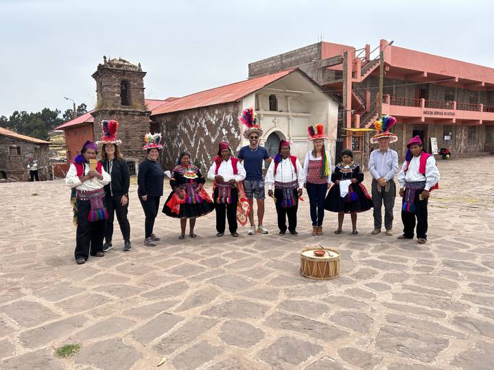 Group with locals in traditional dress.