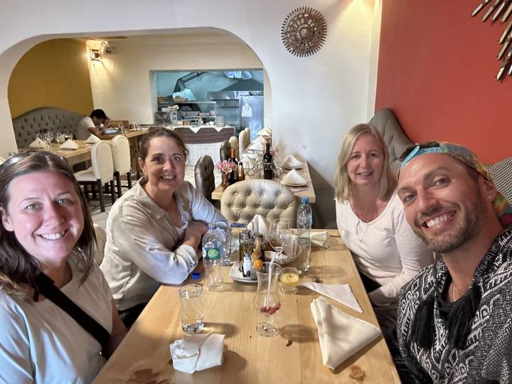 Group of people dining at a restaurant.