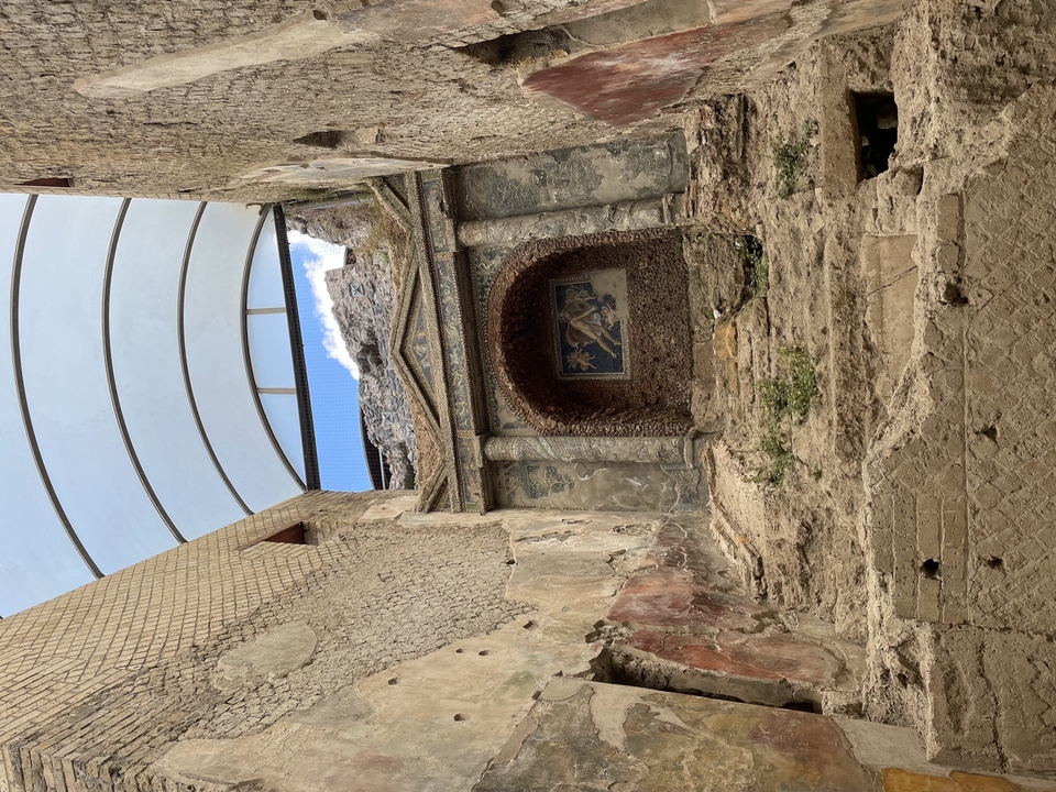 An ancient stone structure with a decorated interior.