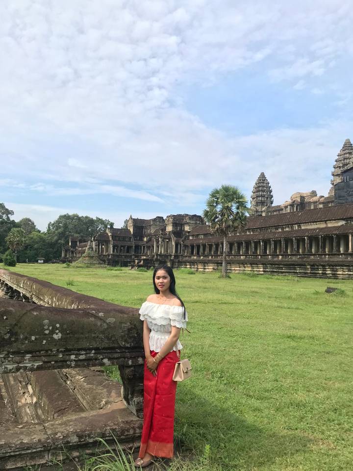 Woman standing near Angkor Wat