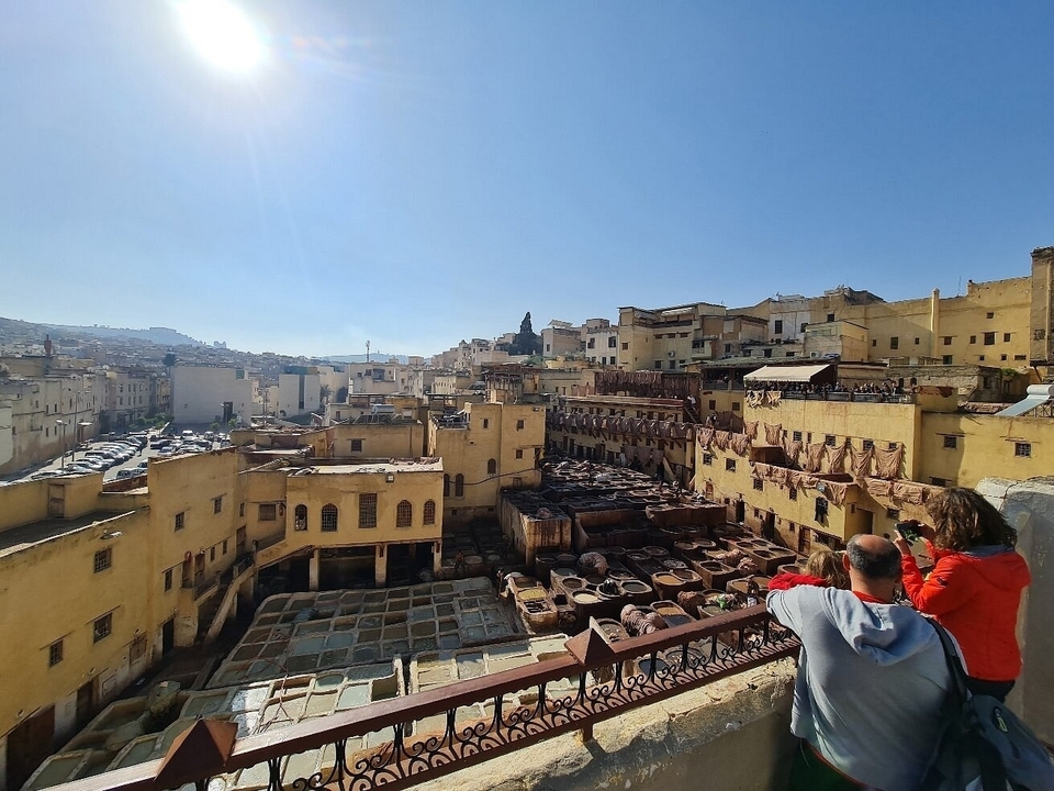 View over the city with people looking at historical tanneries.