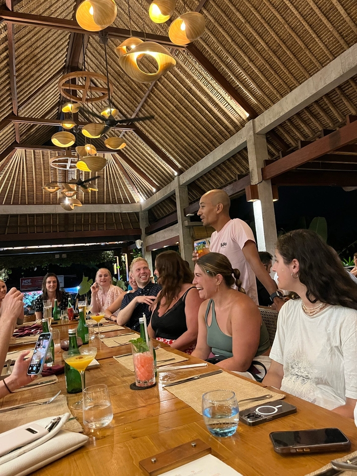 People dining in a traditional open-air restaurant.
