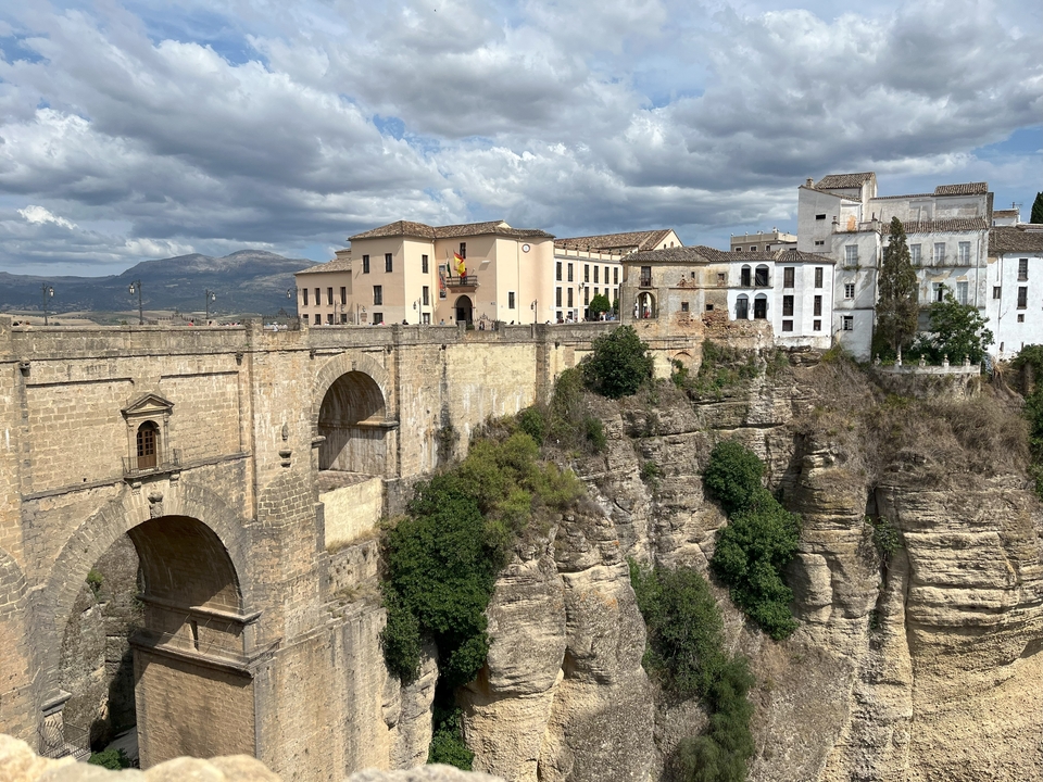 Historical bridge and cliff-side village.