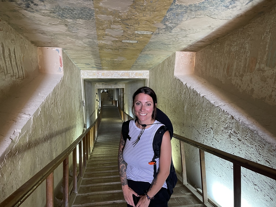 Woman inside an ancient Egyptian tunnel.