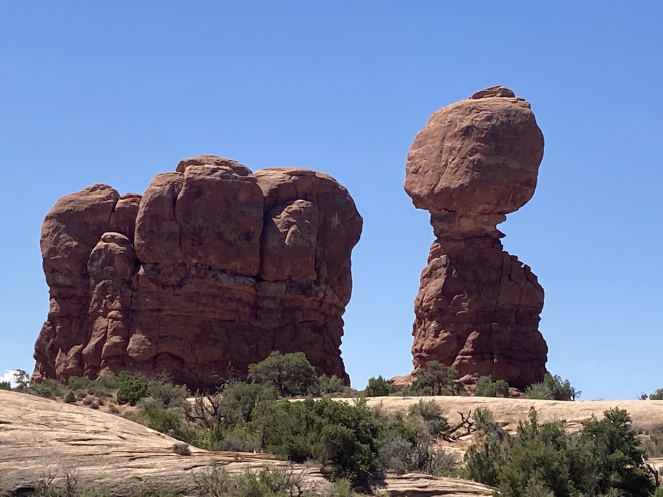 Balanced rock formations in a desert landscape.