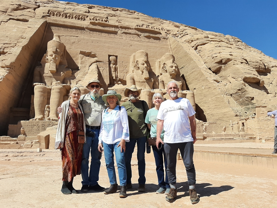 Group of tourists posing in front of the Abu Simbel temples.