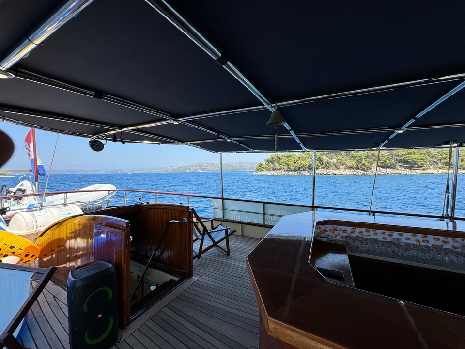 View from a boat overlooking the sea and nearby land.