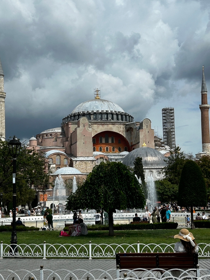 Exterior view of a large historic mosque with domes and minarets.