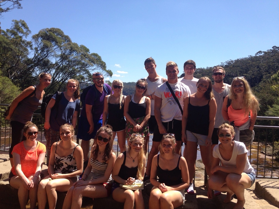 Group of people posing on a sunny day.