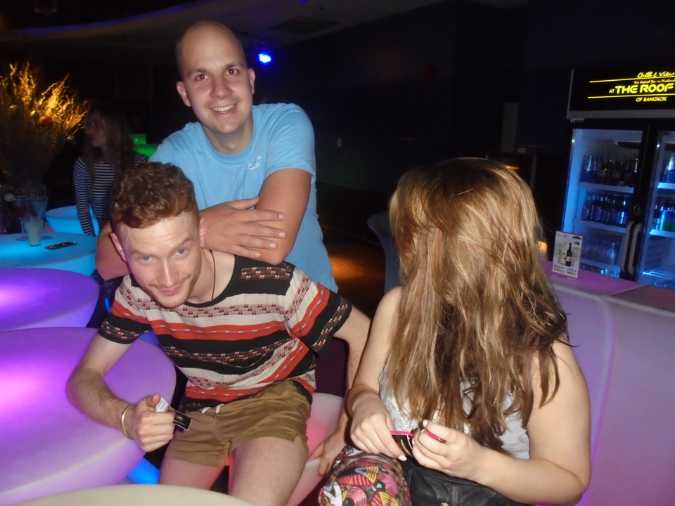 People enjoying drinks at a vibrant setting.