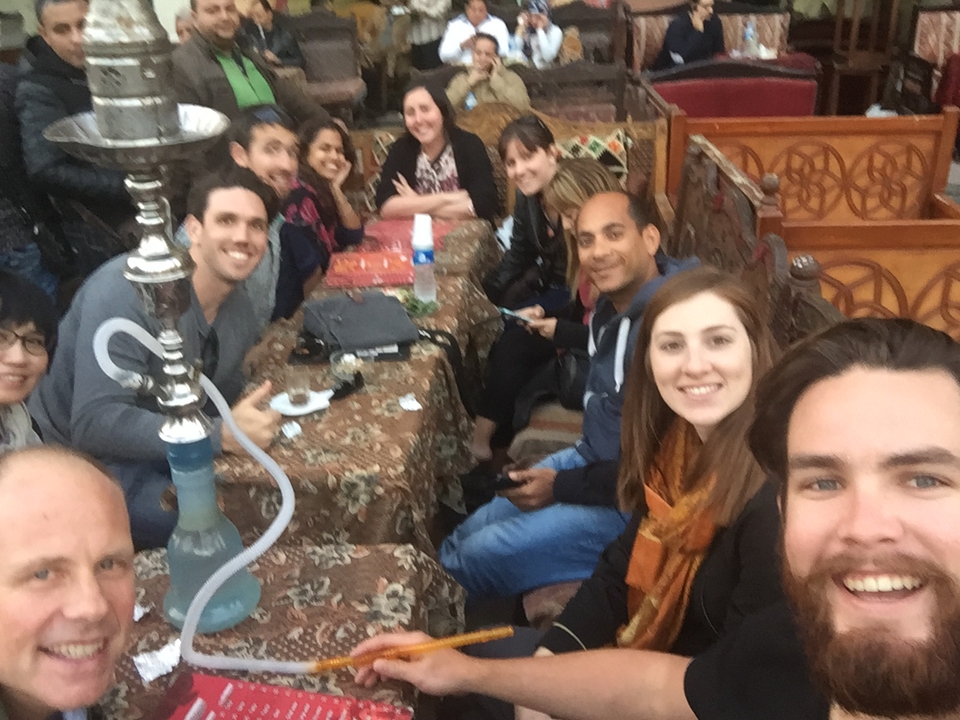 Group of people socializing at a cafe or restaurant.