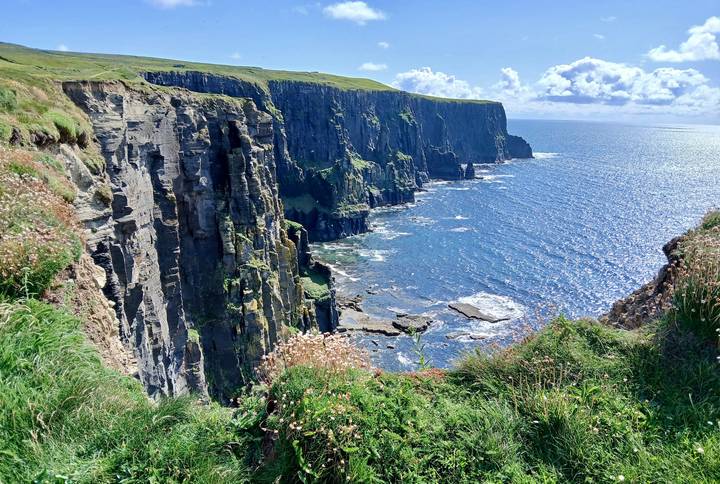 Majestic view of tall sea cliffs with the ocean below.