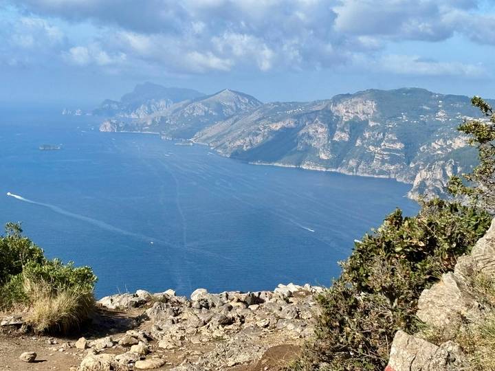 Panoramic view of the coastline with mountains and the sea.