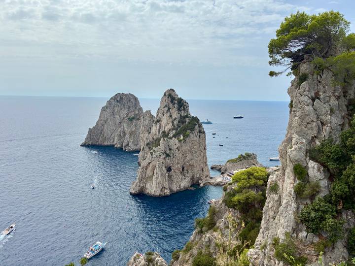 Iconic rock formations in Capri with the sea in the background.