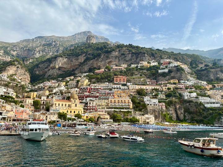 Positano's colorful buildings cascading down the hillside to the sea.