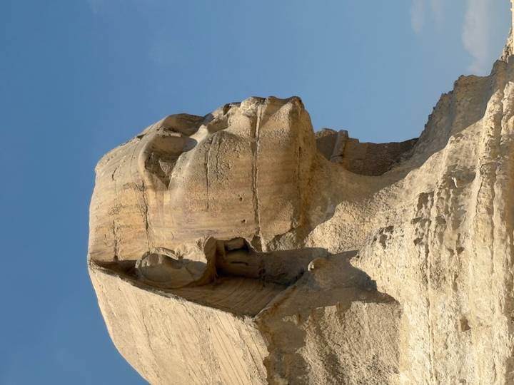 Close-up view of the Sphinx statue against a clear blue sky.