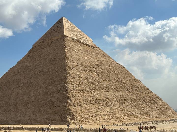 A pyramid in Giza photographed with a clear sky background.