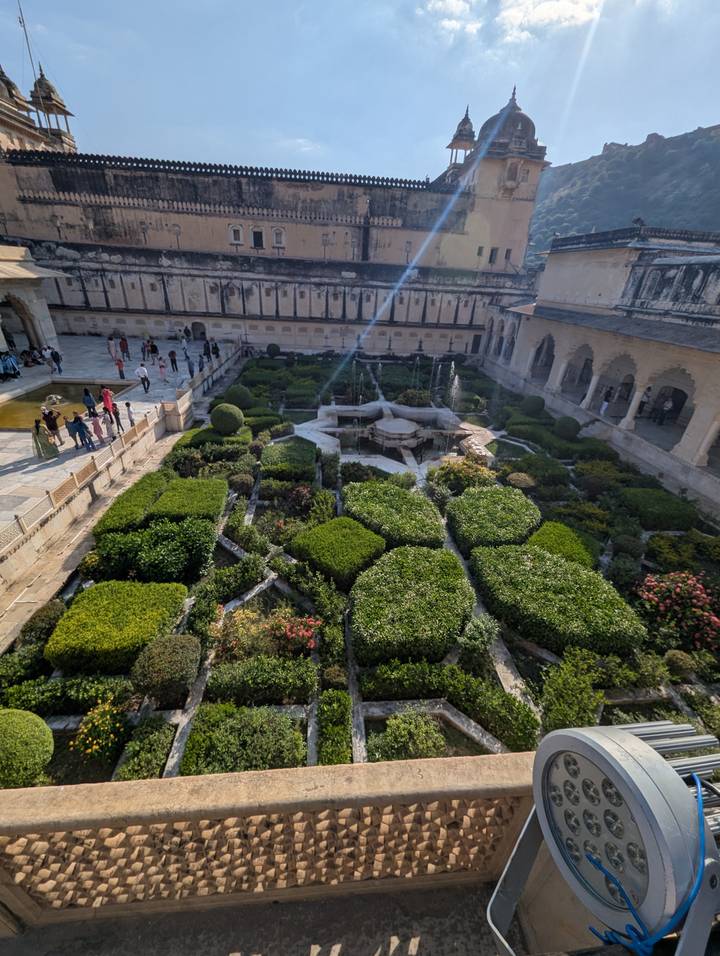 Gardens viewed from above in a historic site.