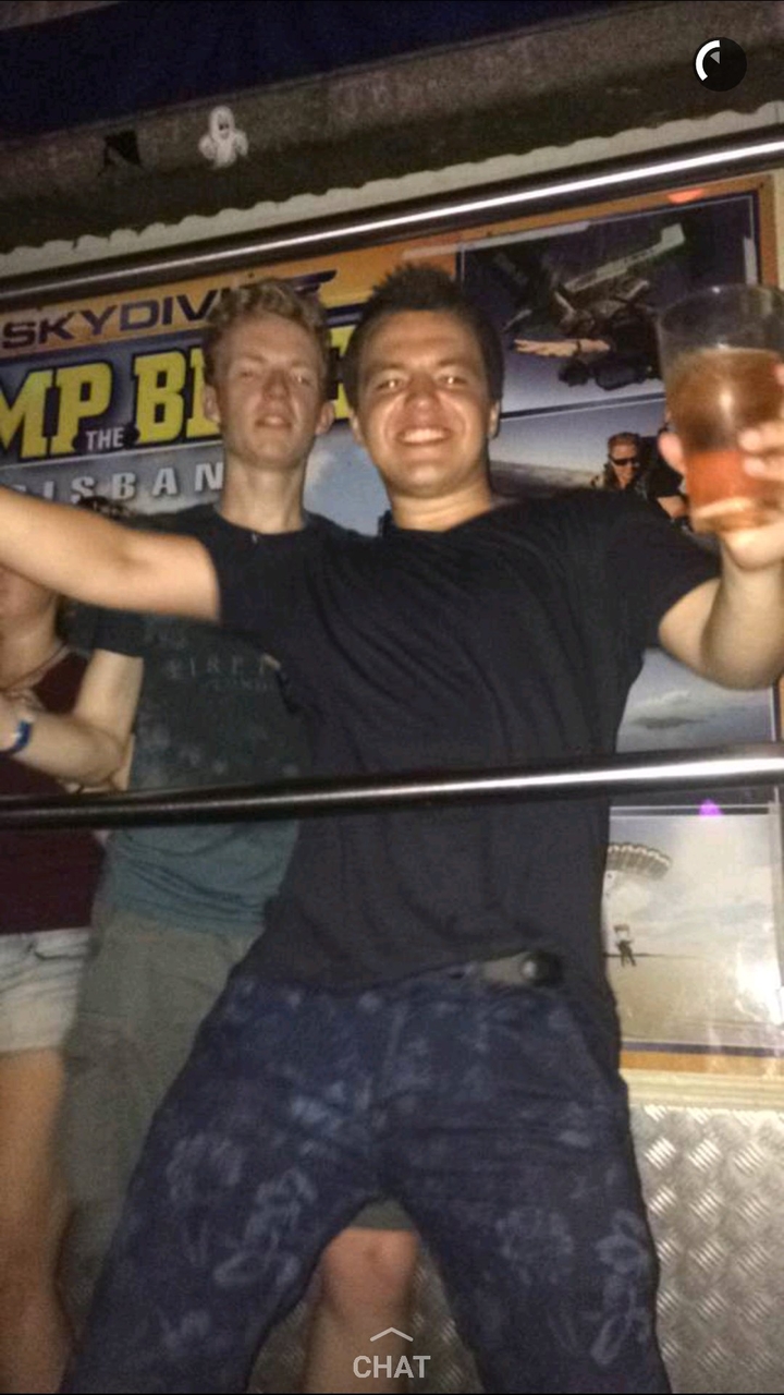 People at a night club with drinks.
