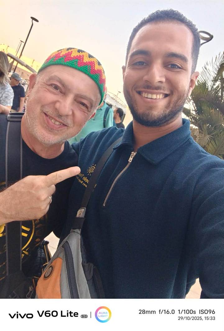 Two people taking a close-up selfie