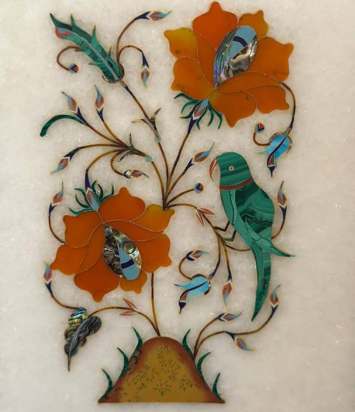 Close-up of colorful inlay design on marble.