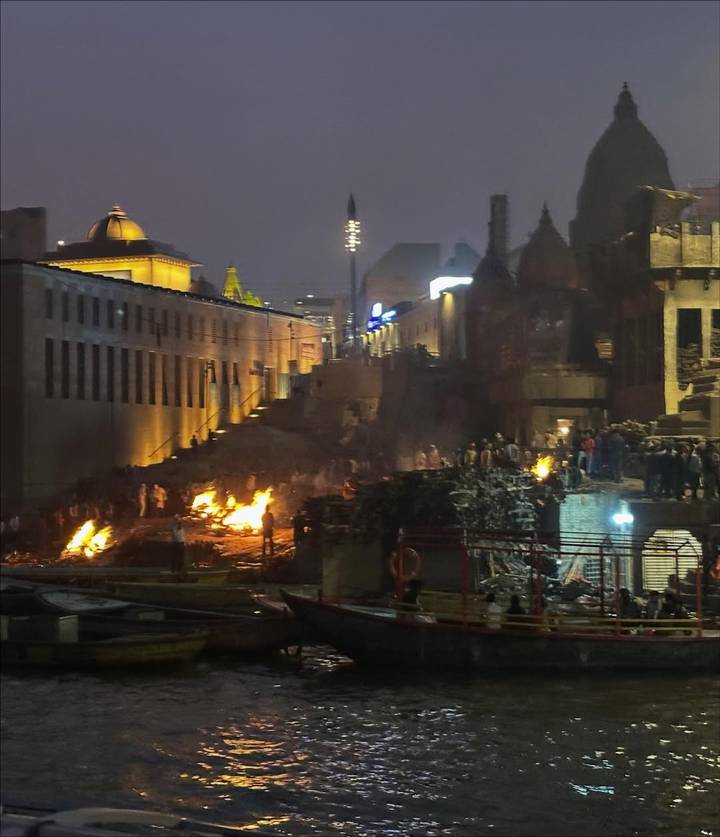 Nighttime ceremony or event at the ghats in Varanasi.