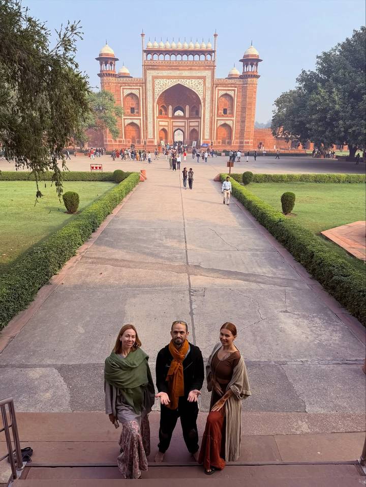 A group posing in a historical courtyard.