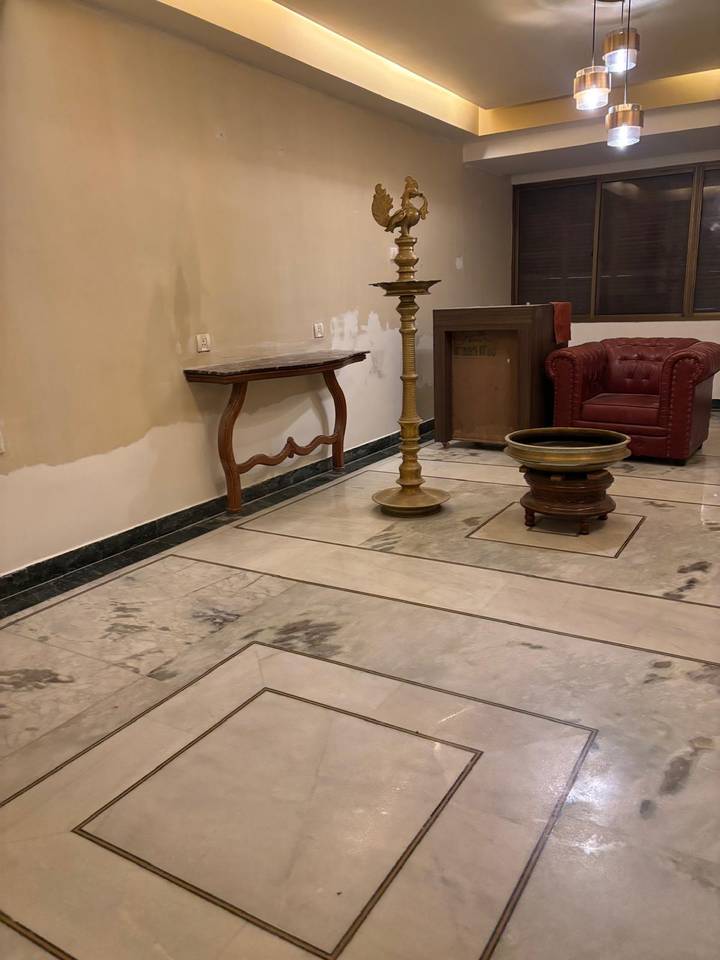 Interior space with furniture and patterned floor.