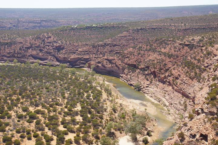 A river winding through a rocky canyon landscape.
