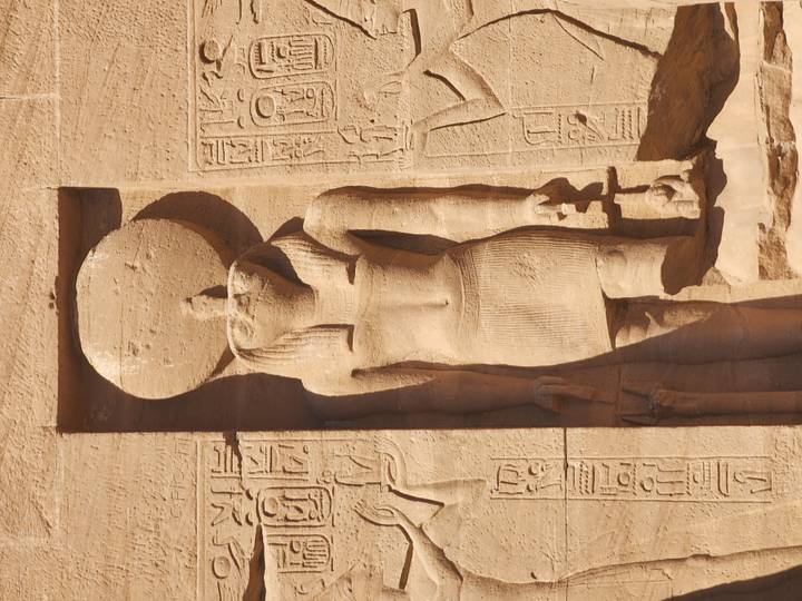 Ancient Egyptian wall carvings with hieroglyphs and figures.