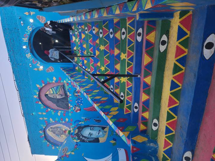 Colorfully painted stairs leading to Nubian House.