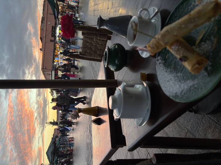 Outdoor cafe scene in a lively market area