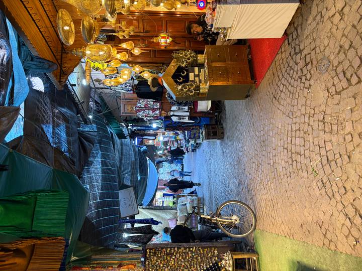 Bustling market street lined with multiple items for sale