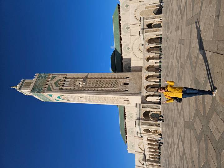 Person in front of Hassan II Mosque in Casablanca.