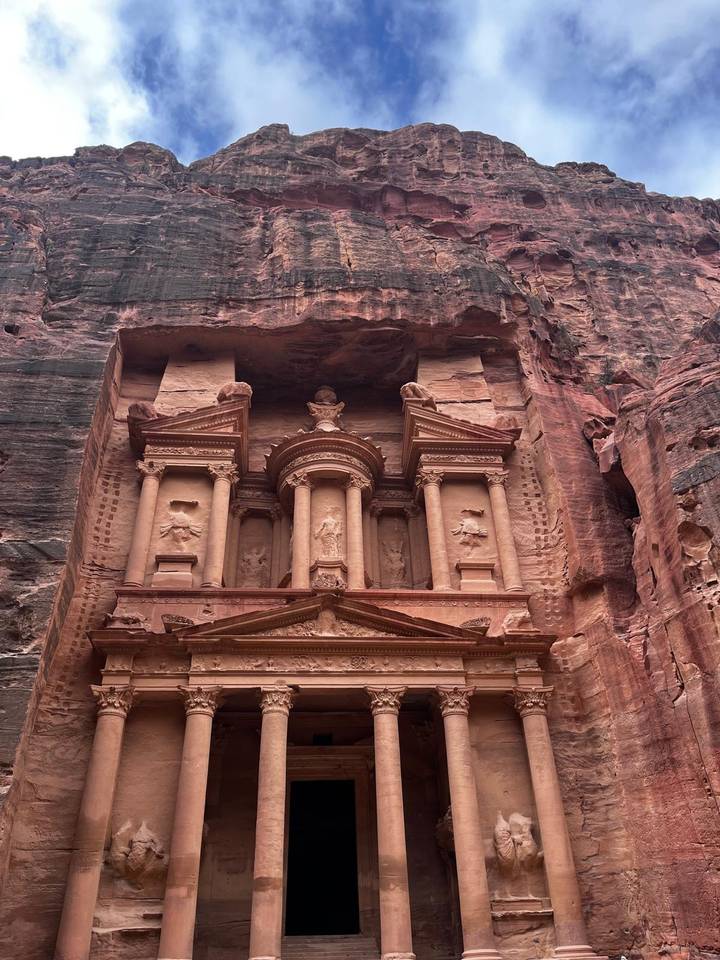 Close-up of Petra’s iconic Treasury façade carved into red sandstone cliffs.