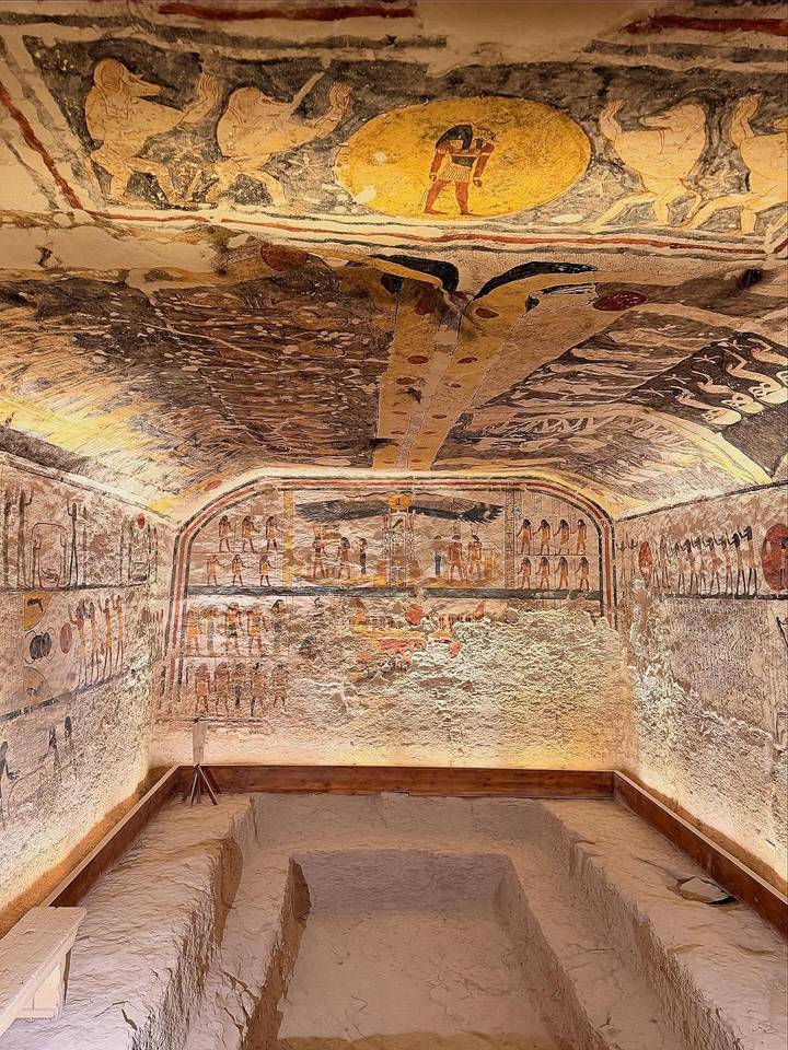 Colorful, well-preserved wall and ceiling paintings inside an ancient Egyptian tomb chamber