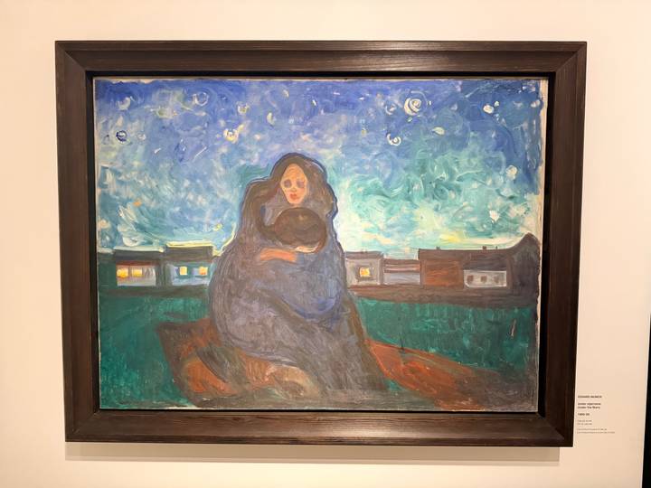 Expressionist painting displayed in a gallery, featuring a mother and child beneath a starry sky.