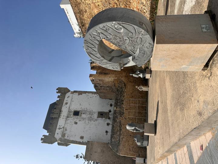 Stone walls and modern sculpture display inside the historic Kasbah of the Udayas
