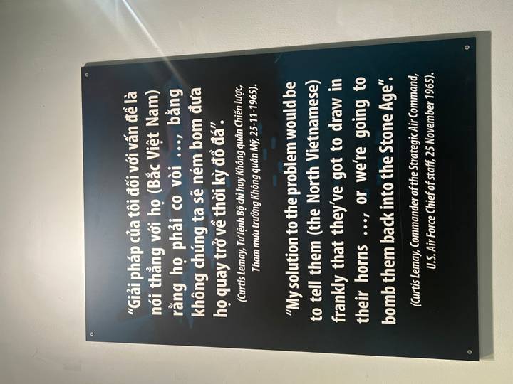 Museum wall panel displaying a bilingual quotation about the Vietnam War.