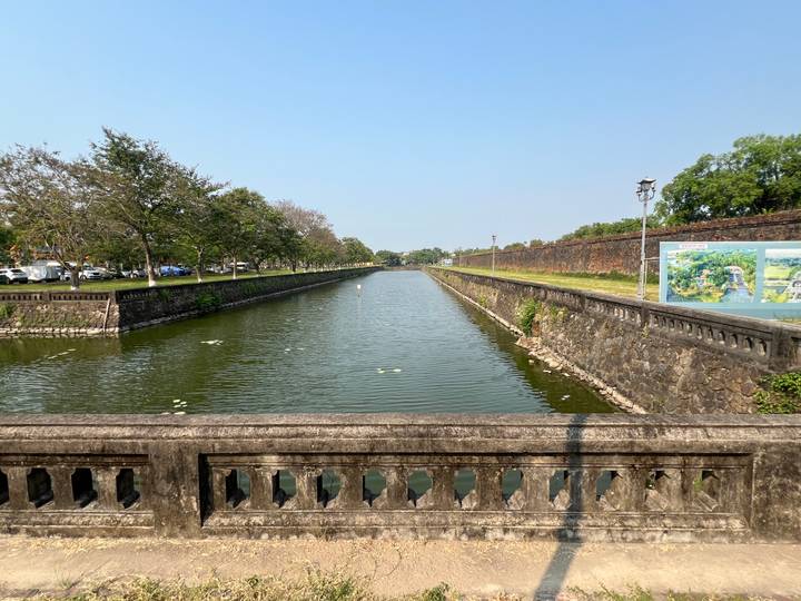 Long rectangular moat lined with stone walls inside the Hue Citadel.